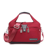 Damen Handtasche mit Schultergurt und mehreren Fächern