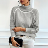 Optimized Product Title: "Aurora Relaxed Fit Rollkragenpullover für Damen - Bequemer, Stilvoller Pullover für Herbst/Winter" 

This title includes relevant keywords while providing additional details about the product, such as the target audience and seas