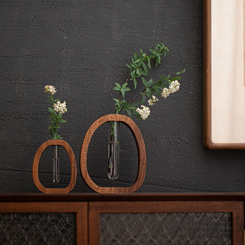 Enhanced Product Title: "Wandvase aus Holz mit Glasröhrchen – Stilvolle Pflanzenzucht und Dekoration für Ihr Zuhause" 

This title includes relevant keywords while emphasizing the product's aesthetic appeal and functionality.