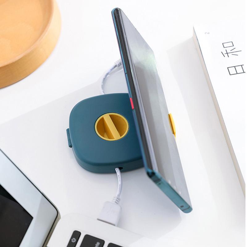 Enhanced Product Title: "2-in-1 Kabelaufroller mit integriertem Telefonständer – Kompakt & Tragbar für unterwegs" 

This title maintains the original product features while adding keywords like "tragbar" (portable) to attract more potential customers sear