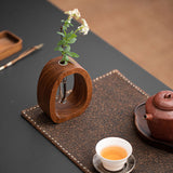 Enhanced Product Title: "Wandvase aus Holz mit Glasröhrchen – Stilvolle Pflanzenzucht und Dekoration für Ihr Zuhause" 

This title includes relevant keywords while emphasizing the product's aesthetic appeal and functionality.