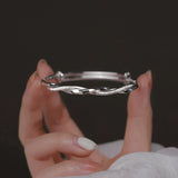 Elegant Twisted Silver Bracelet Bowlift
