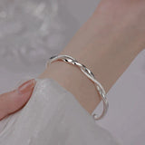 Elegant Twisted Silver Bracelet Bowlift