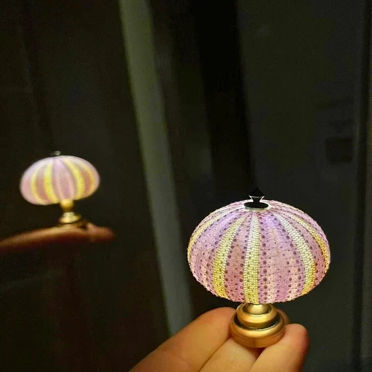 Enhanced Product Title: "Seeigel Nachtlampe - Elegante LED Kinder-Nachtlicht mit sanfter Beleuchtung für beruhigende Nächte" 

This title includes relevant keywords and provides more detail about the product, which can help improve visibility and attract