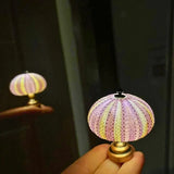 Enhanced Product Title: "Seeigel Nachtlampe - Elegante LED Kinder-Nachtlicht mit sanfter Beleuchtung für beruhigende Nächte" 

This title includes relevant keywords and provides more detail about the product, which can help improve visibility and attract