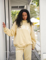Pastel Yellow Varsity Mockneck Sweatshirt with Navy Letters - Stylish & Comfortable Unisex Apparel