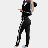 Black women's tracksuit with white stripes, hood, athletic, comfortable, fashionable.