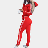 Red women's tracksuit with hood, white stripes, casual fashion, sportswear.