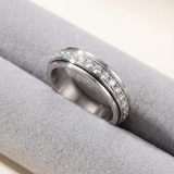 Enhanced Product Title: "Zirkonia-Drehring mit Rotierendem Band - Eleganter Schmuckring mit Funkelnden Zirkonia-Steinen für Damen" 

This title includes relevant keywords while providing more detail about the product, which can help improve visibility and