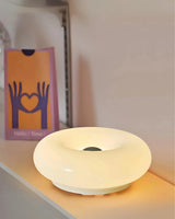 Enhanced Product Title: "Donut-Form Runde Tischlampe mit Sanftem LED-Licht – Stilvolle Beleuchtung für Ihr Zuhause" 

This title includes relevant keywords while maintaining clarity and appeal for potential customers.