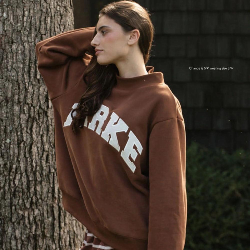 Enhanced Product Title: "Varsity Mockneck Sweatshirt - Mocha with Cloud Letter Design | Trendy Casual Wear" 

This title includes relevant keywords for better visibility while clearly describing the product.