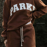 Enhanced Product Title: "Varsity Mockneck Sweatshirt - Mocha with Cloud Letter Design | Trendy Casual Wear" 

This title includes relevant keywords for better visibility while clearly describing the product.