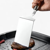 Optimized Product Title: "Quadratischer Grill- und Pfannenwender mit Holzgriff – Präzise Wendehilfe für perfekten Grillgenuss" 

This title includes relevant keywords while enhancing clarity and appeal for potential buyers.
