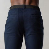 Dark blue men's pants, fitted, elastic waistband, fashionable, comfortable, high-quality fabric.