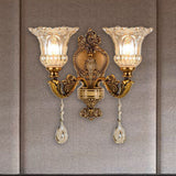 Classic gold vintage wall light with glass lampshades and crystal pendants.