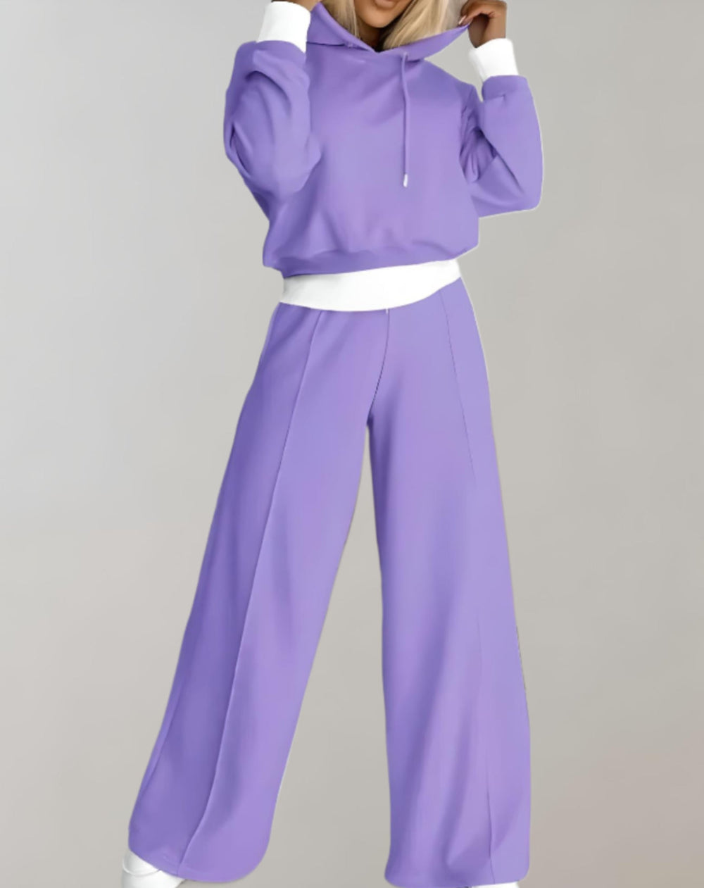 Woman in purple jogger set, hoodie and wide-leg pants, casual fashion, comfortable outfit.