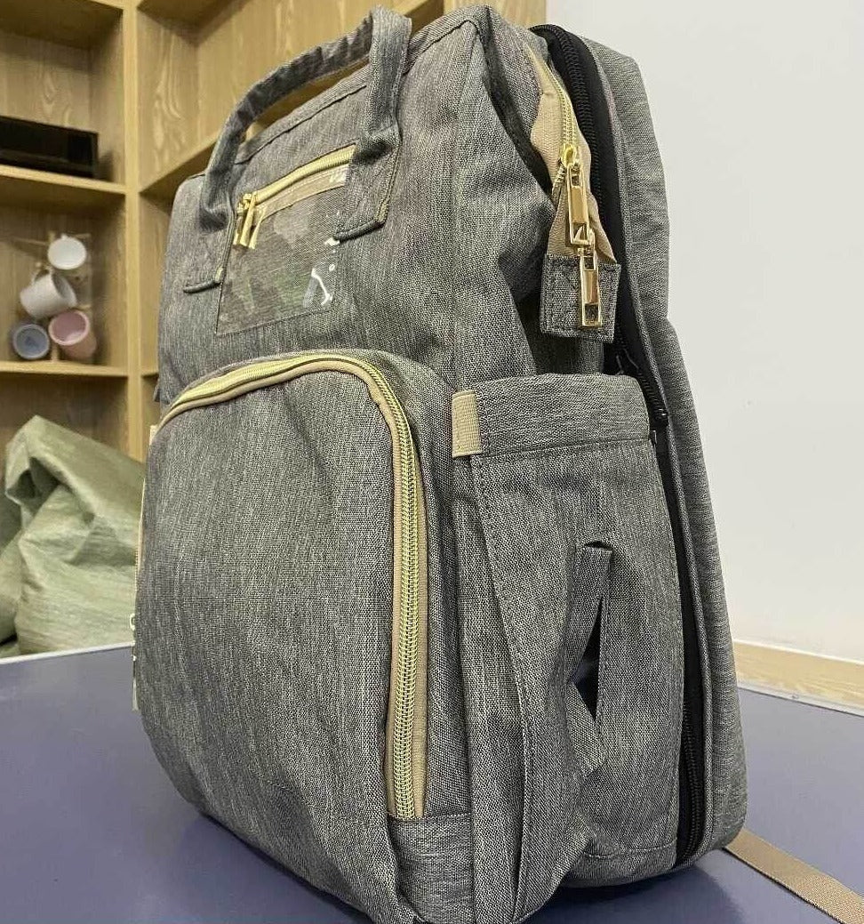 Enhanced Product Title:  
"Convertible Baby Diaper Backpack with Foldable Bassinet | Waterproof Multi-Pocket Design for Ultimate Convenience"  

This title is optimized for clarity and includes relevant keywords that potential customers might search for,