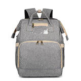 Enhanced Product Title:  
"Convertible Baby Diaper Backpack with Foldable Bassinet | Waterproof Multi-Pocket Design for Ultimate Convenience"  

This title is optimized for clarity and includes relevant keywords that potential customers might search for,
