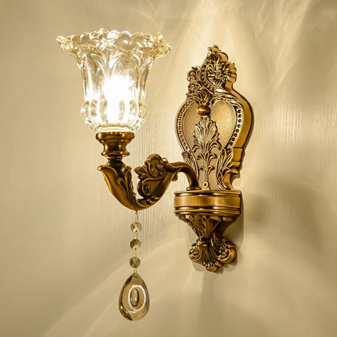 Antique brass wall light with glass lampshade, vintage style, decorative lighting.