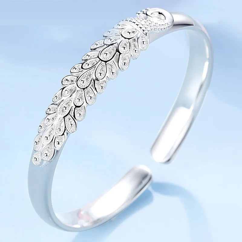 Elegant Sterling Silver Peacock Charm Bracelet - Unique Artisan Jewelry for Women