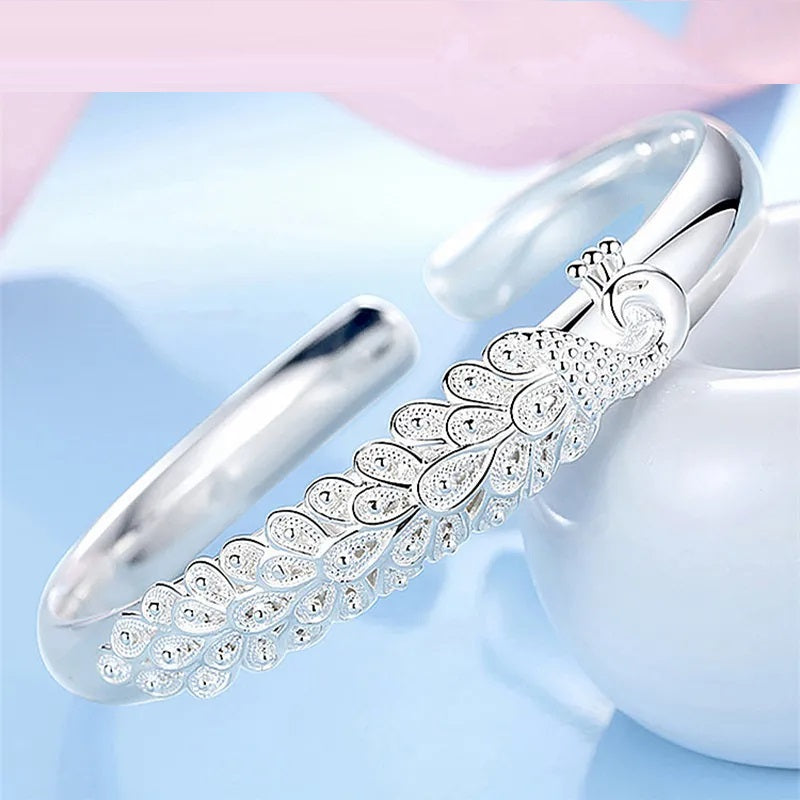 Elegant Sterling Silver Peacock Charm Bracelet - Unique Artisan Jewelry for Women