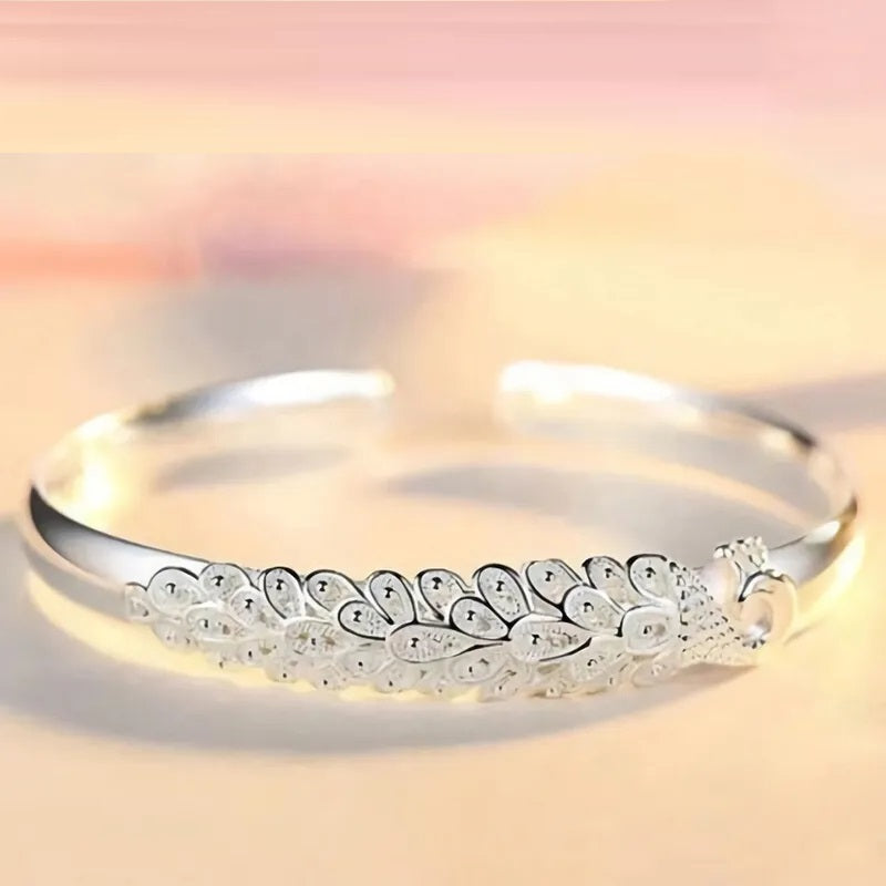 Elegant Sterling Silver Peacock Charm Bracelet - Unique Artisan Jewelry for Women