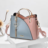 Handtasche Kunstleder mit Metallhenkeln und Herz-Anhänger